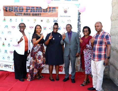 The MP, Dr. Cindy Magara, Prof. Helen N. Nkabala, Dr. Eve Nabukya and Dr. Levis Mugumya flash Tuko Pamoja symbol in a group photo. Department of Literature, School of Languages, Literature and Communication, College of Humanities and Social Sciences (CHUSS) screening of Tuko Pamoja, a documentary by Dr. Cindy Magara, Nyati Motion Pictures, 13th May 2025, Main Hall, Makerere University, Kamapala Uganda, East Africa.