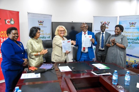 Prof. Barnabas Nawangwe (3rd R) and Ms. Jo Midgley (3rd L) shake hands after signing the MoU as H.E. Nimisha Madhvani (2nd L), H.E. Miriam Otengo (L), Prof. Helen Nambalariwa Nkabala (R) and Mr. Emmanuel Kitamirike (2nd R) witness on 17th October 2025. Makerere University and the University of the West of England (UWE) sign MoU aimed at strengthening collaboration in research, innovation, and enterprise development, 17th October 2025, Main Building, Kampala Uganda, East Africa.